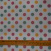 Tela estampada de lunares multicolor para flamenca sobre fondo blanco