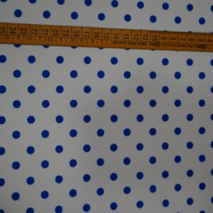 Tela flamenca blanca con lunares azul real medianos, ideal para trajes de flamenca.